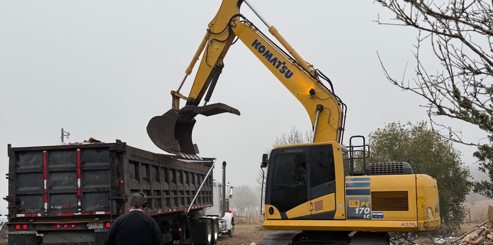 Brannigan Land Services demolishing small structure with excavator in Central Florida