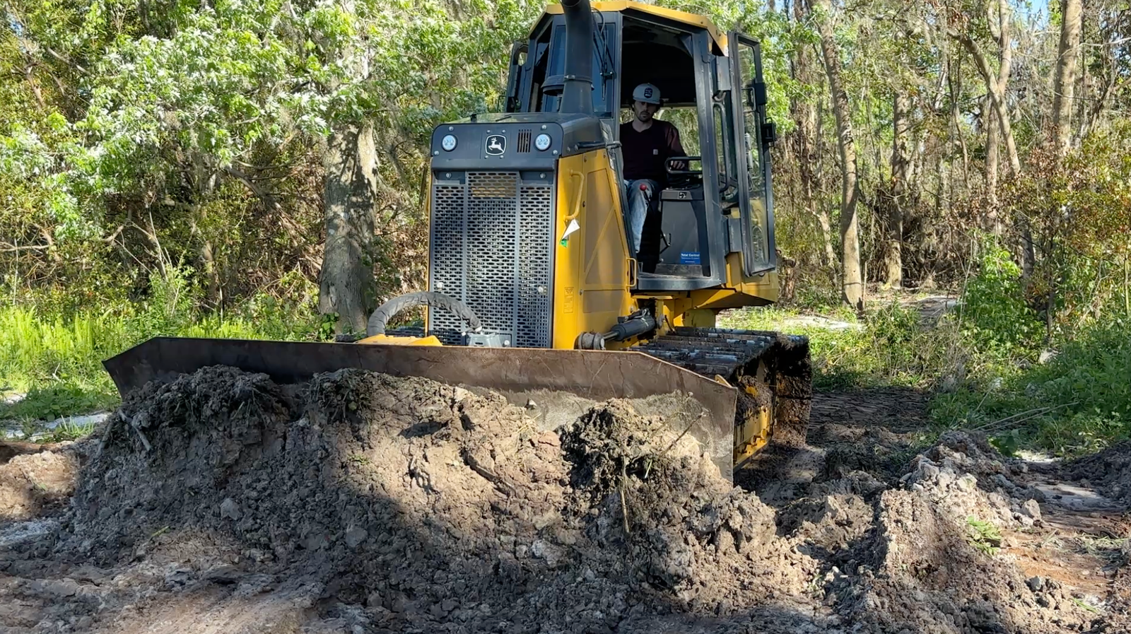 10 acre land clearing in Polk County Florida near Winter Haven using excavator and skid steer for site preparation